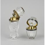 Two perfume bottles, silver gold plated