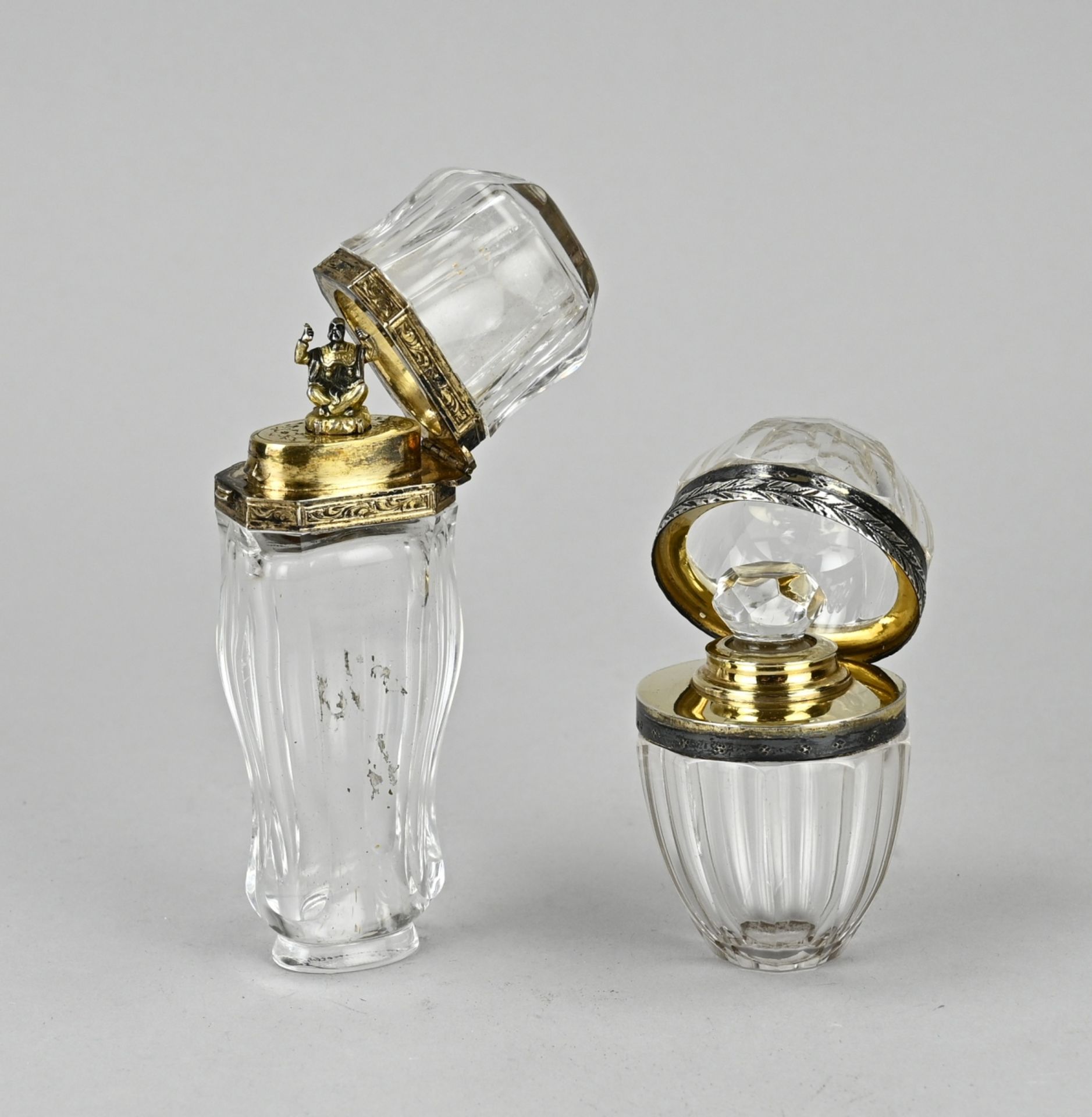 Two perfume bottles, silver gold plated