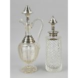 2 Decanters with silverware