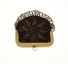 Gold purse bracket on bag