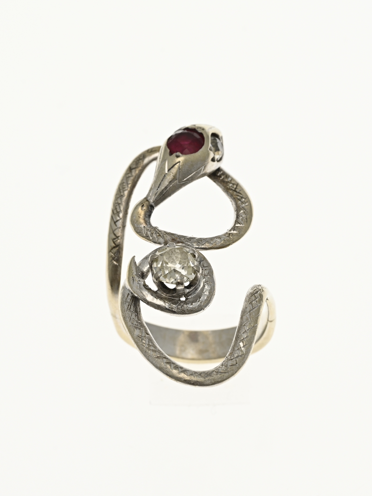 White gold snake ring with ruby and diamond.