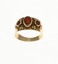 Gold band ring with red coral