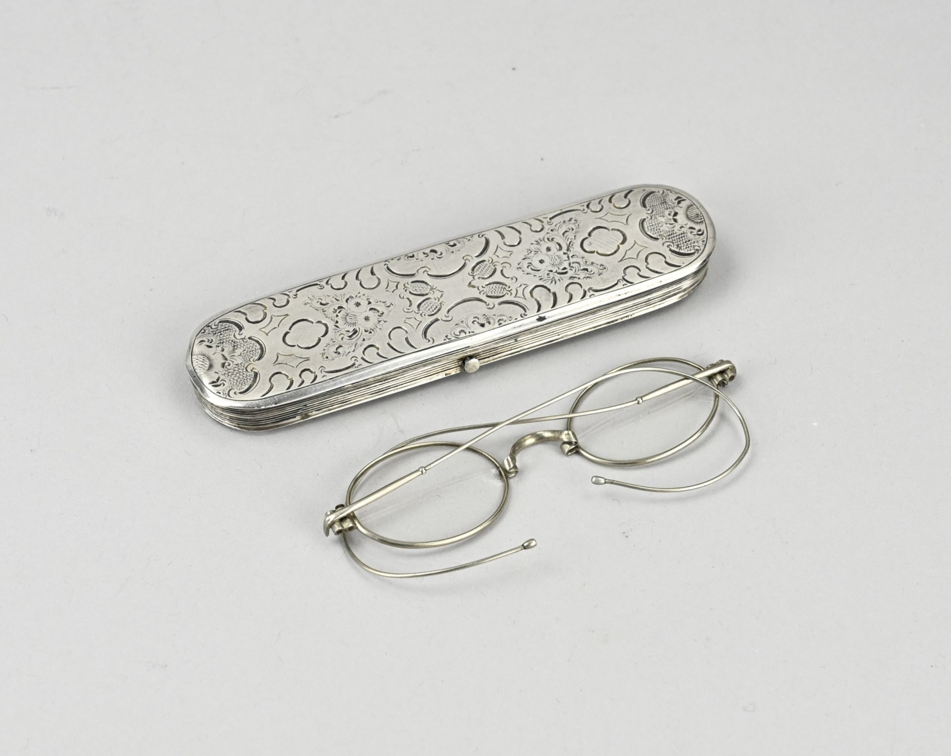 Silver glasses case with glasses