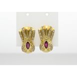 Gold ear studs with diamond and ruby