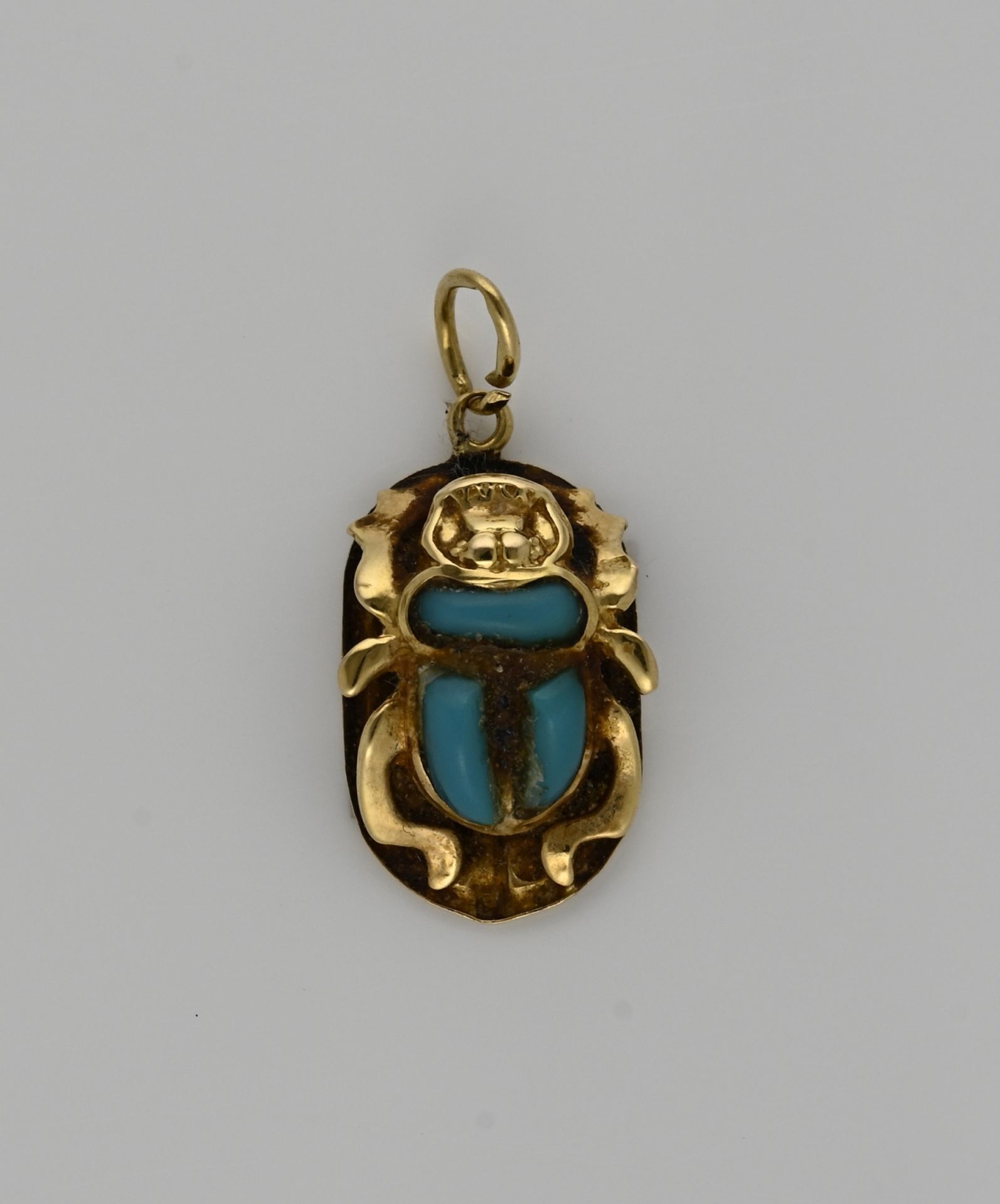 Gold pendant with turquoise