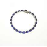 Silver bracelet with blue stone
