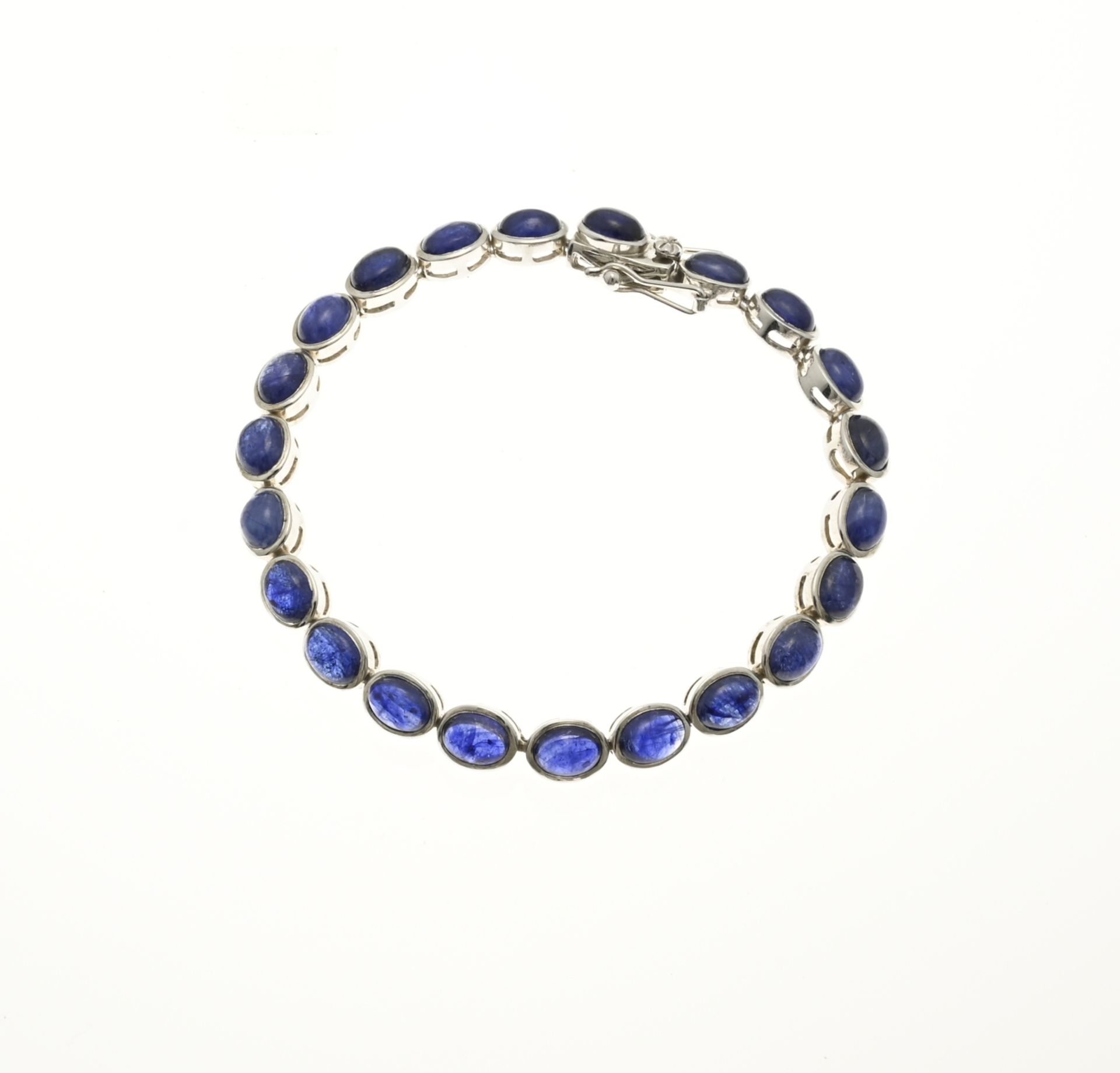 Silver bracelet with blue stone