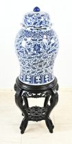 Capital Chinese vase on ottoman