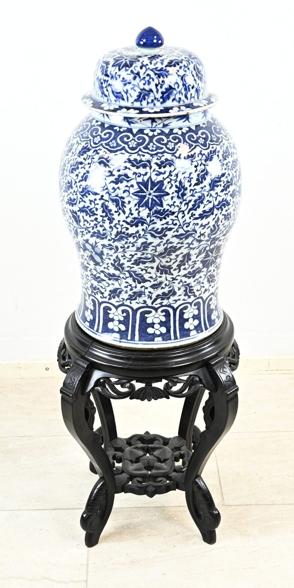 Capital Chinese vase on ottoman