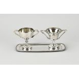 2 Small silver goblets on a saucer