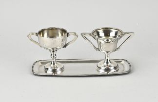 2 Small silver goblets on a saucer