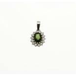 White gold pendant with diamond and green stone