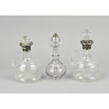 3 Decanters with silverware