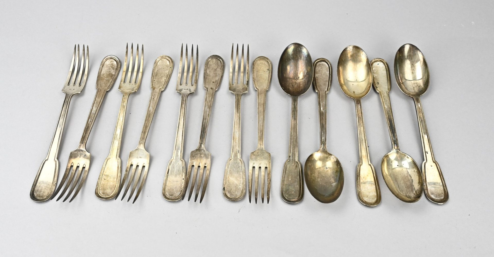 Silver spoons and forks, 12 with line decor