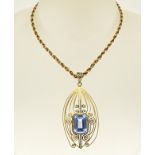 Gold necklace and pendant with blue stone
