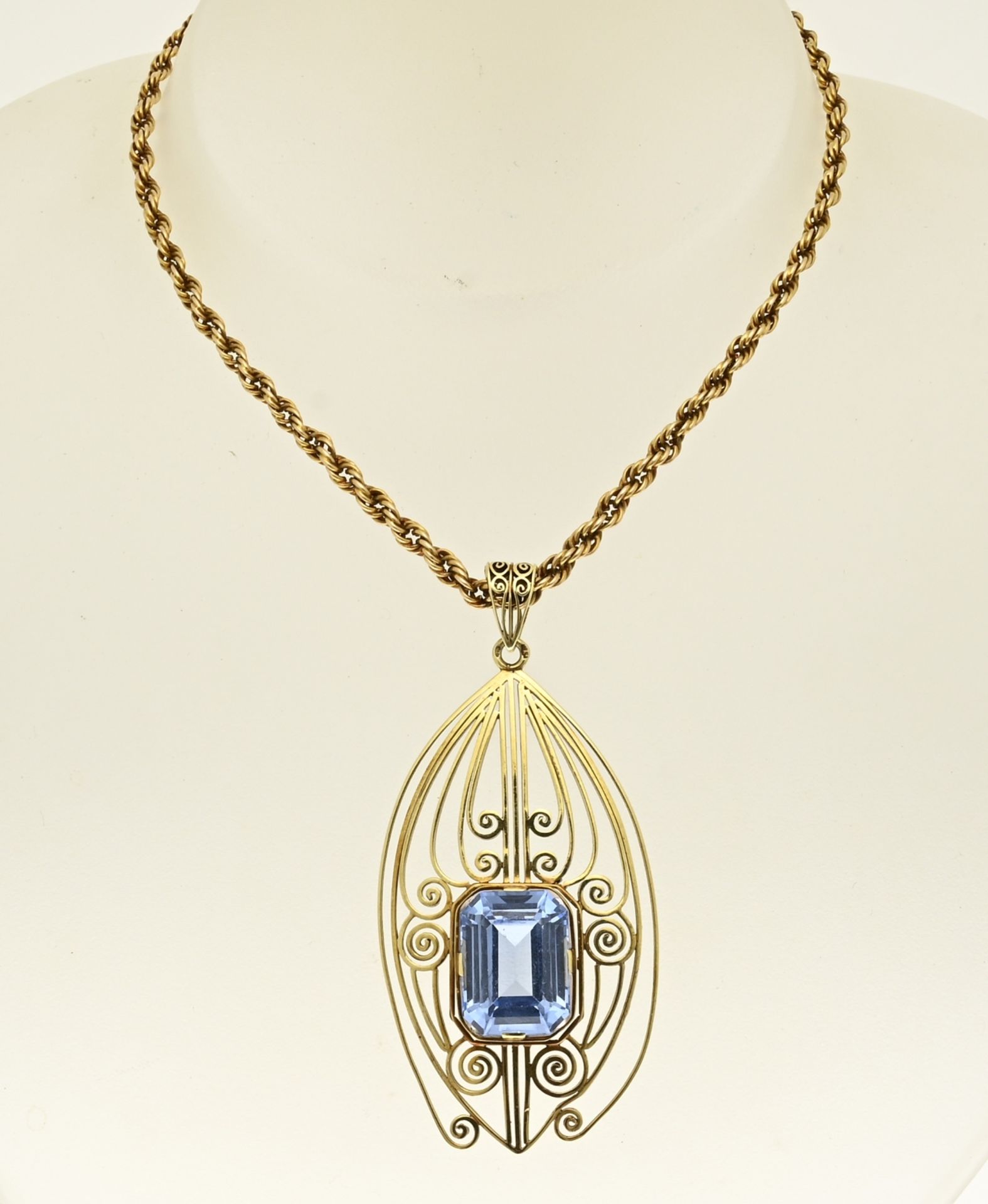 Gold necklace and pendant with blue stone