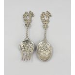 Silver spoon and fork with figures