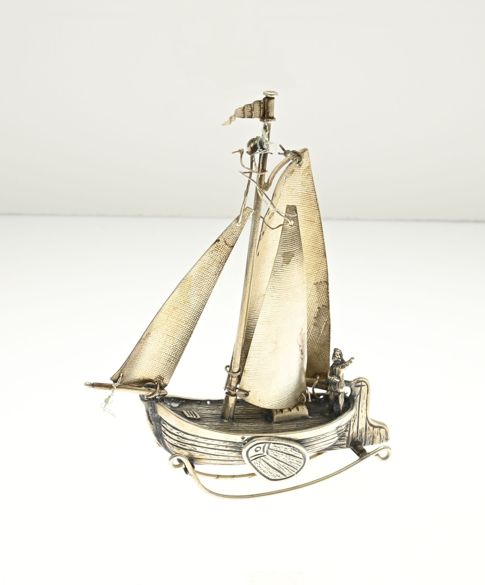 Silver miniature sailboat