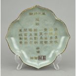 Chinese celadon plate with text Ã˜ 21 x 21.5 cm.