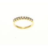 Yellow gold row ring with diamond