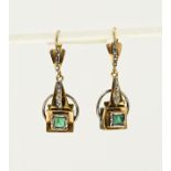 Earrings with emerald