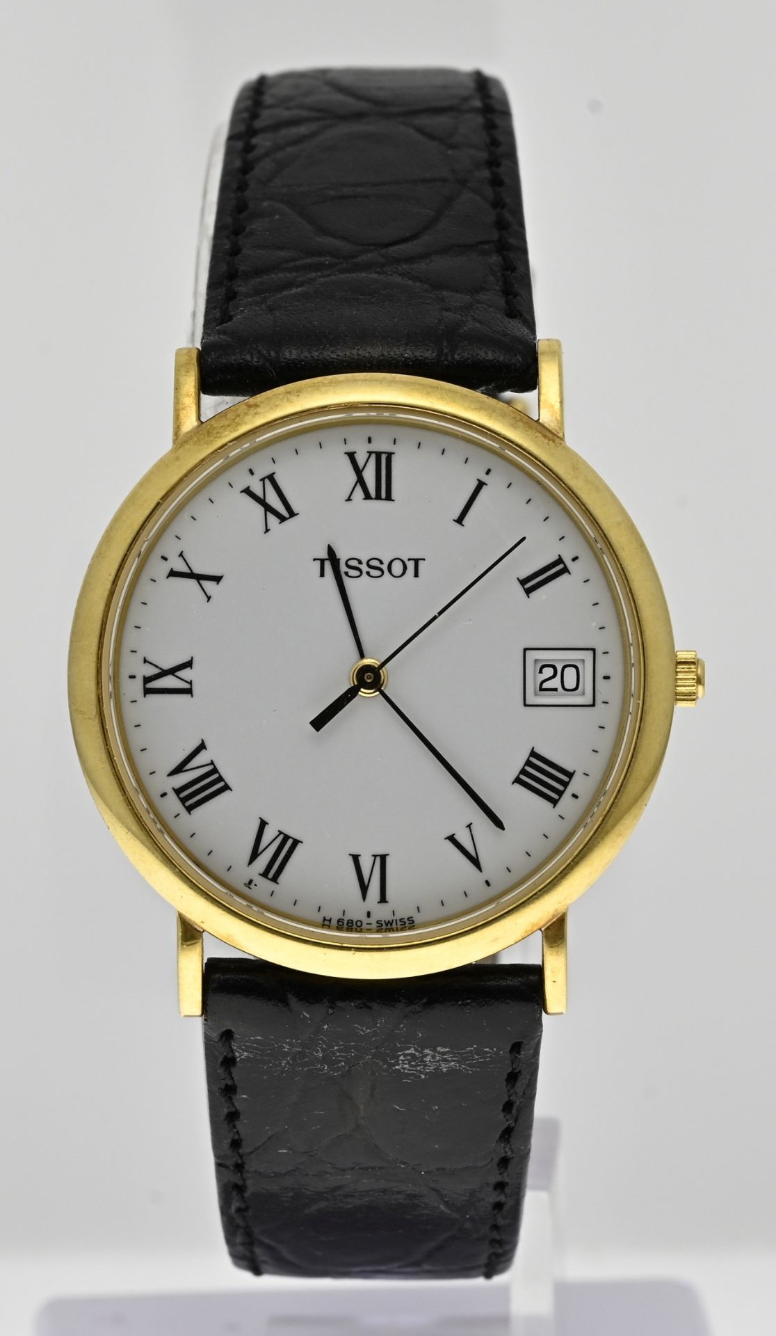 Gold Tissot watch