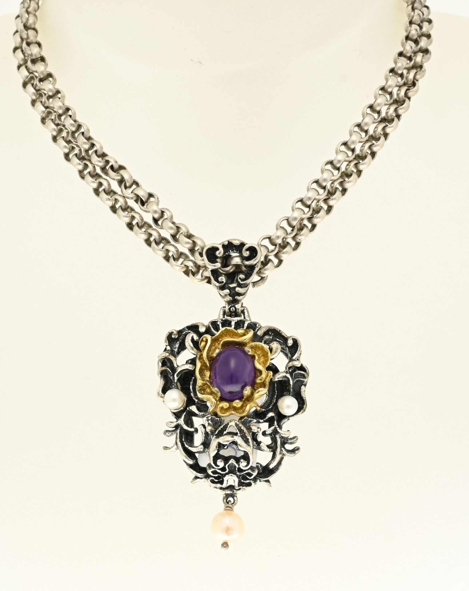 Silver jasseron necklace with amethyst pendant