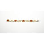 Gold bracelet with red coral