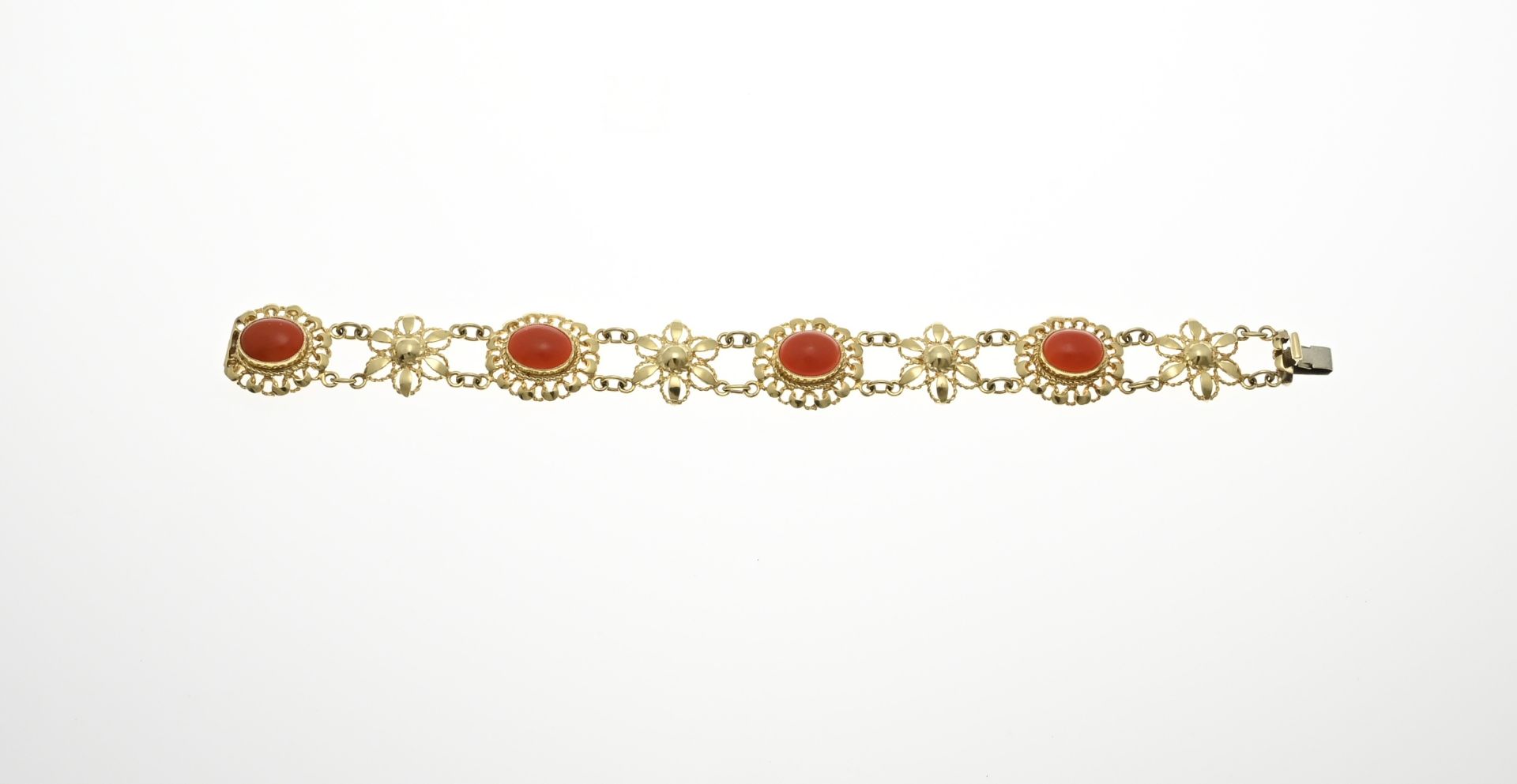 Gold bracelet with red coral