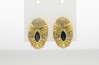 Gold stud earrings with diamond and sapphire