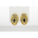 Gold stud earrings with diamond and sapphire