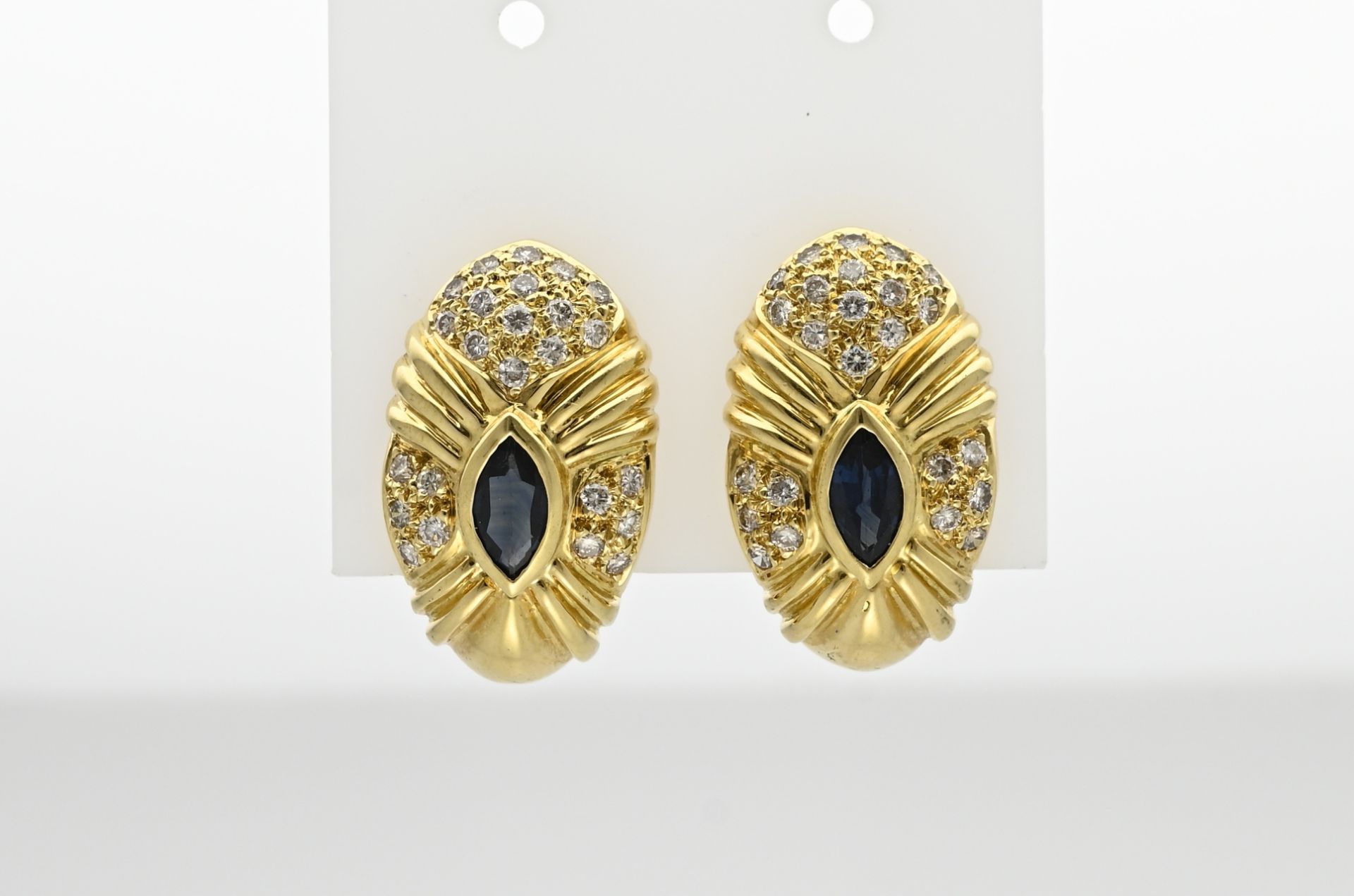 Gold stud earrings with diamond and sapphire