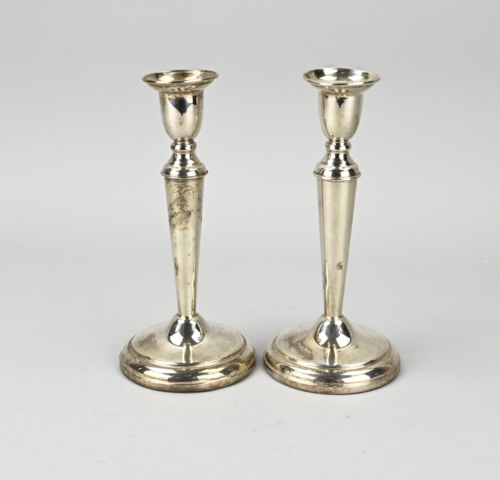 Two silver candlesticks