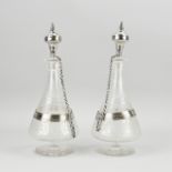 2 Decanters with silverware