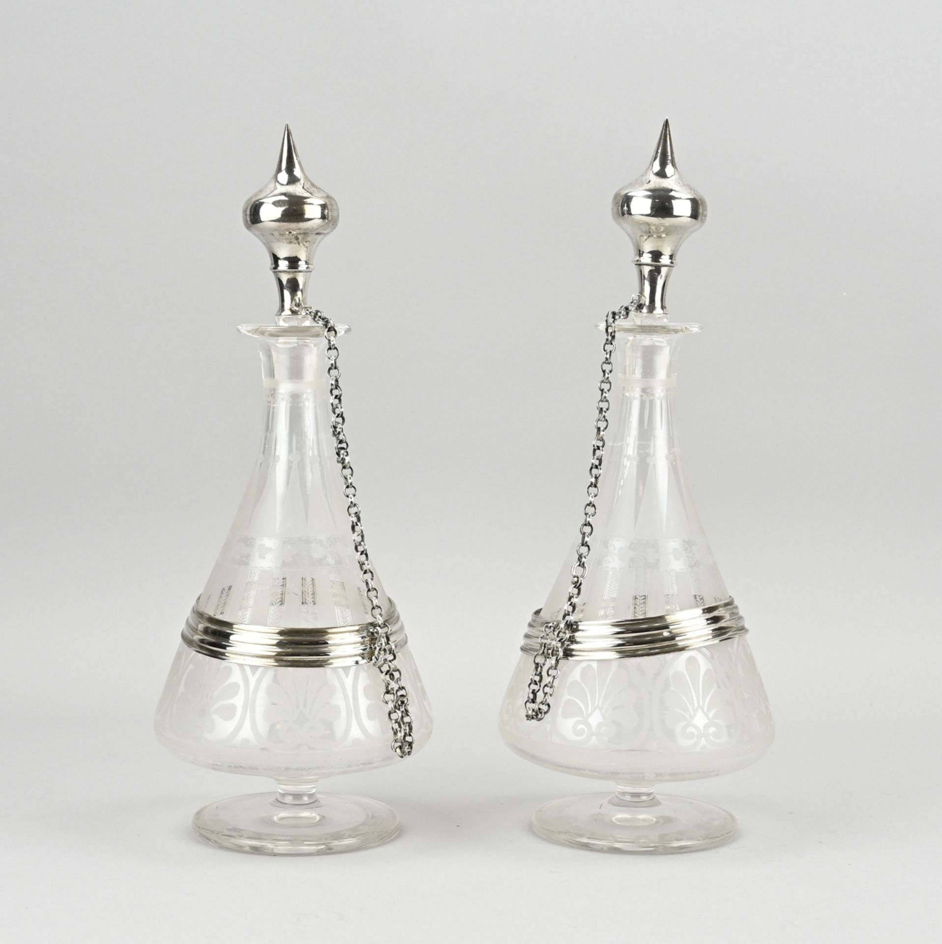 2 Decanters with silverware