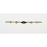 Gold brooch with onyx and pearl