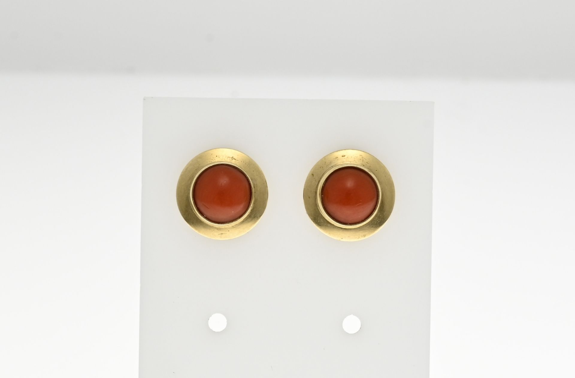 Gold stud earrings with red coral