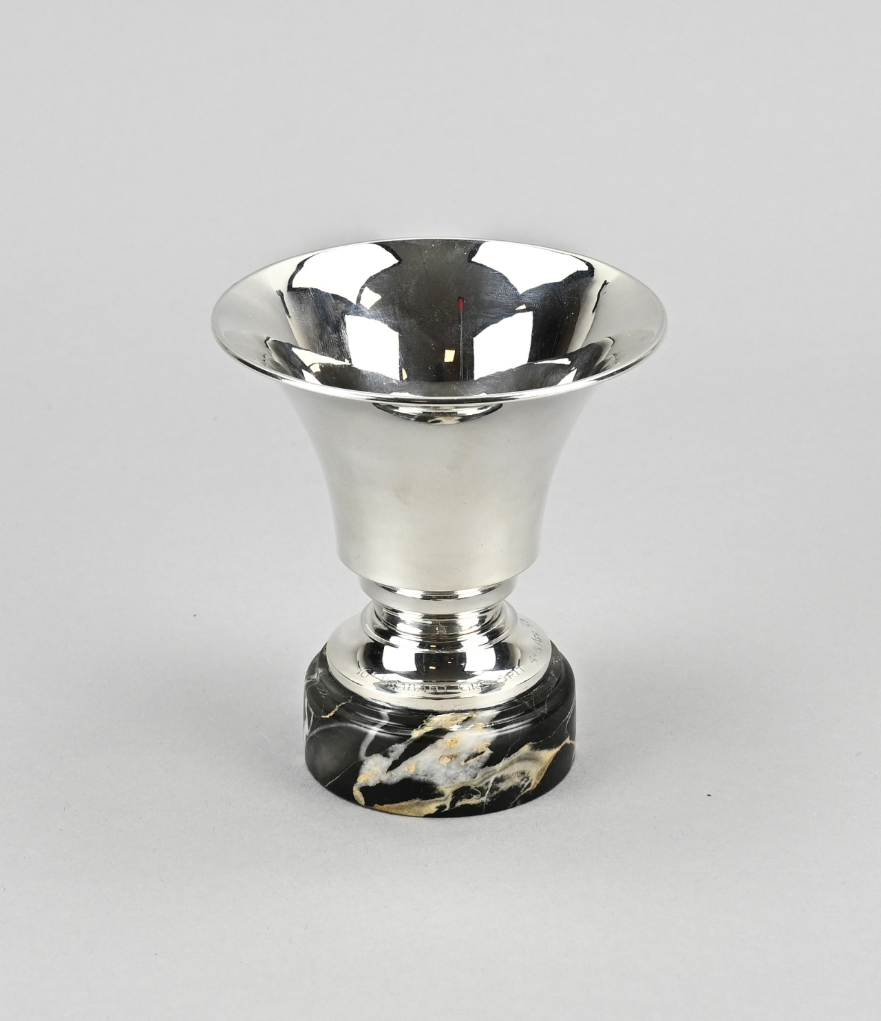 Silver chalice on marble base