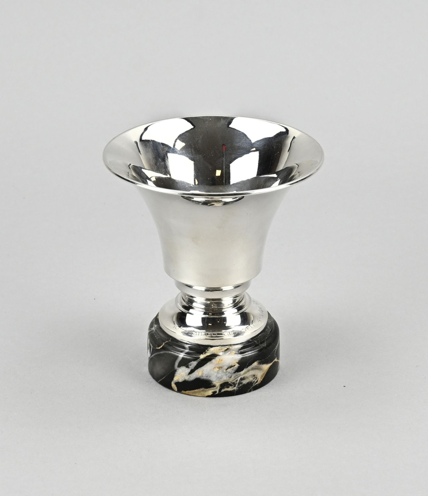 Silver chalice on marble base