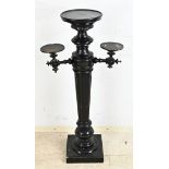 Ebonized flower table, H 112 cm.