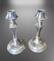 A Pair of Silver Plated Art Nouveau Candle Sticks, 7 inches in height