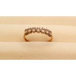 9ct Gold Ring set with 7 small diamonds, weight 1.31g, Size M
