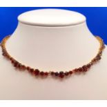 9ct Gold Garnet Necklace. Length is 16 inches and weight is 20g
