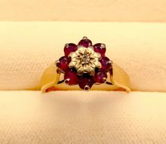 A 9ct Gold, Ruby & Diamond cluster ring, hallmarked, Size J/K, weight 2.5g