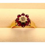 A 9ct Gold, Ruby & Diamond cluster ring, hallmarked, Size J/K, weight 2.5g
