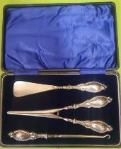 A 1923 Cased Silver Glove Stretcher, Button Hook and Shoe Horn