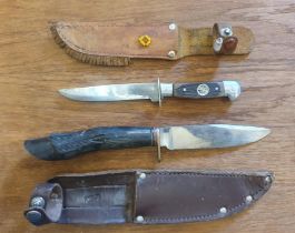 Two Knives with Sheaths, one with compass