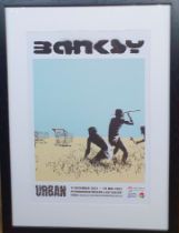 A Large Framed Banksy Exhibition Poster from Peterborough 2022. Framed size 36 inches x 26 inches