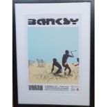 A Large Framed Banksy Exhibition Poster from Peterborough 2022. Framed size 36 inches x 26 inches