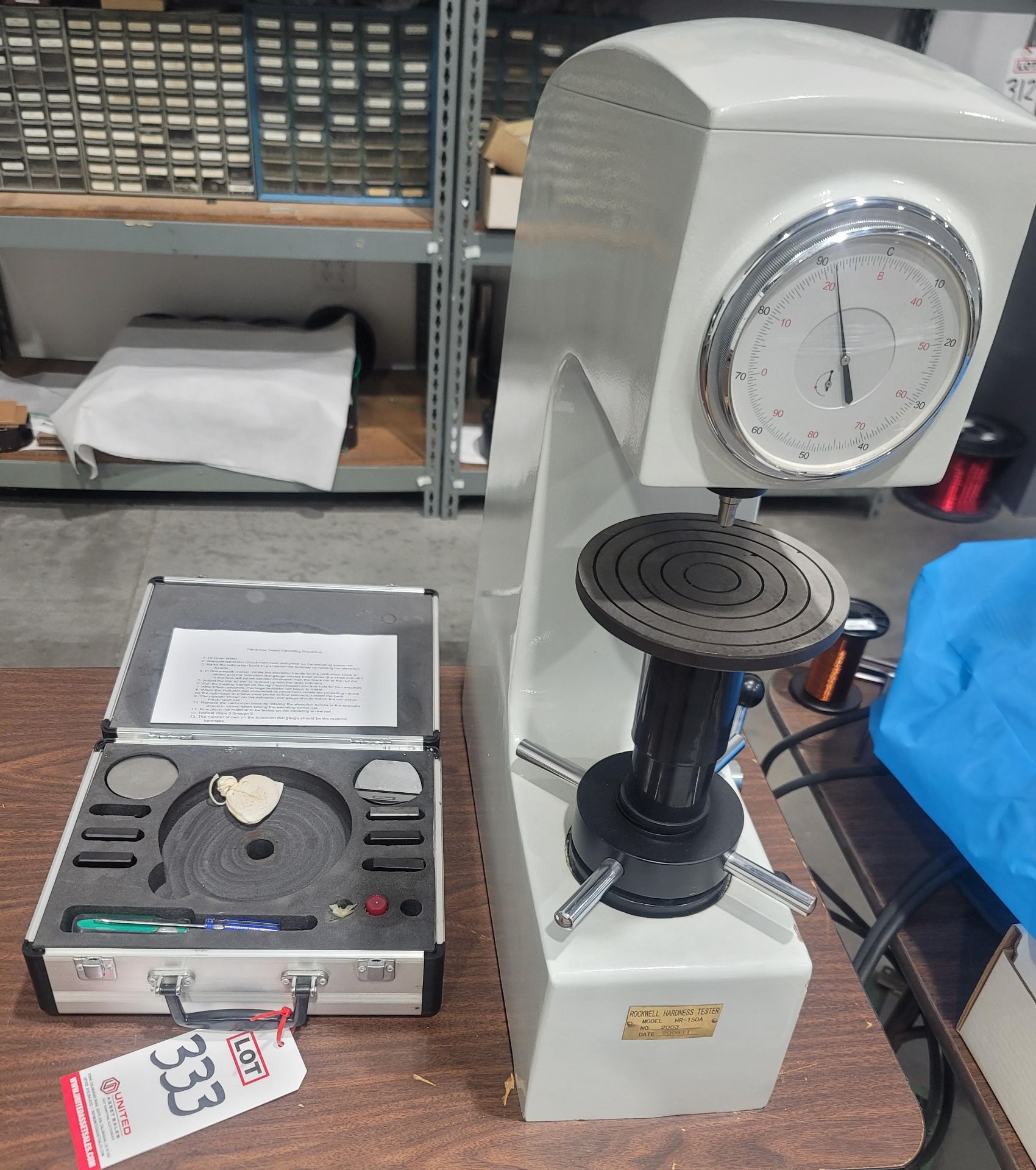 LOT - ROCKWELL HARDNESS TESTER, MODEL HR-150A, W/ TEST KIT, (ATTACHED THROUGH TABLE WHICH IS